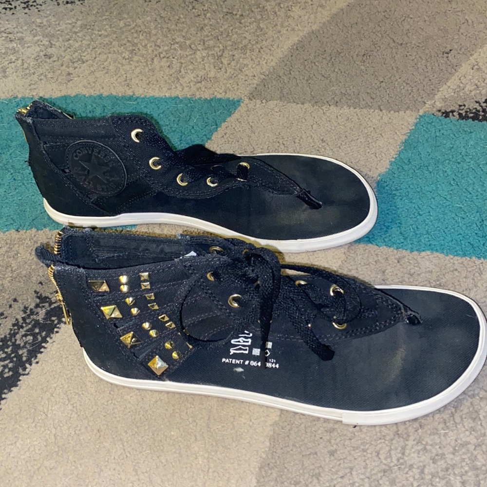 Slightly used. Worn about 5 times. Converse sandals. Black with gold accents.